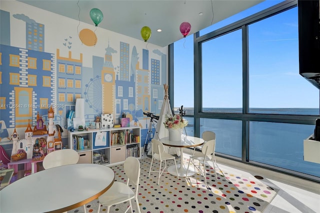 dining area featuring a wall of windows