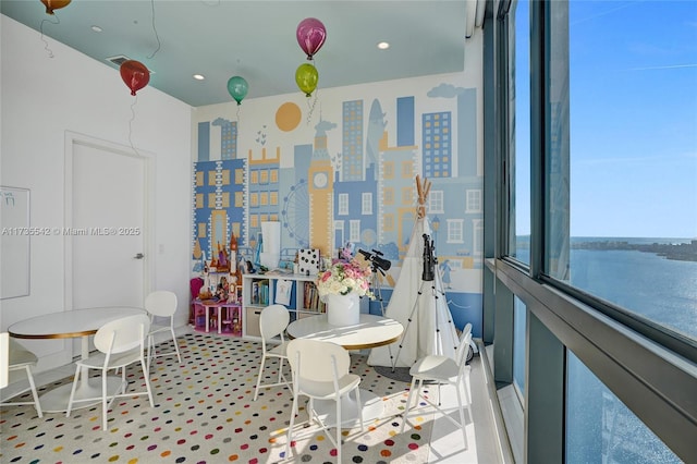 playroom featuring a water view