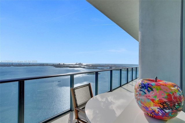 balcony featuring a water view