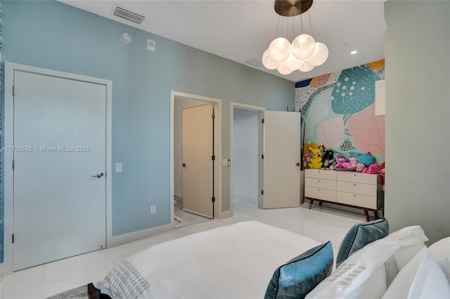 bedroom with light tile patterned flooring and an inviting chandelier