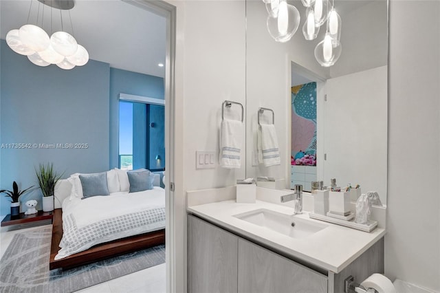 bathroom with vanity and a chandelier