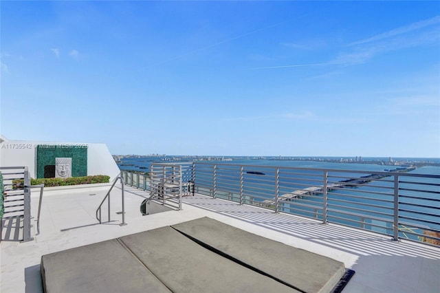 view of patio featuring a water view