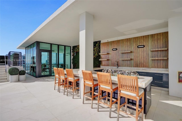 view of patio / terrace with an outdoor bar