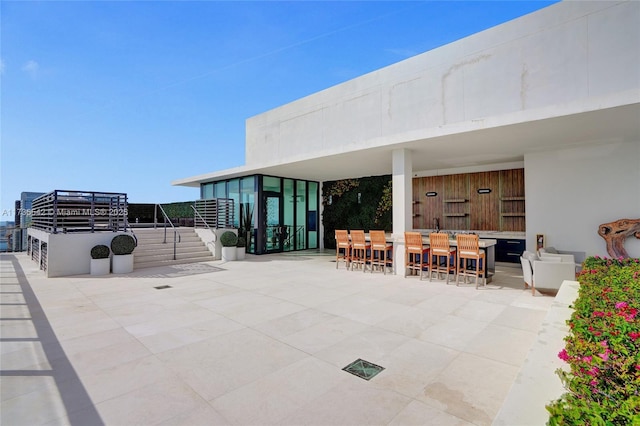 view of patio / terrace with an outdoor bar