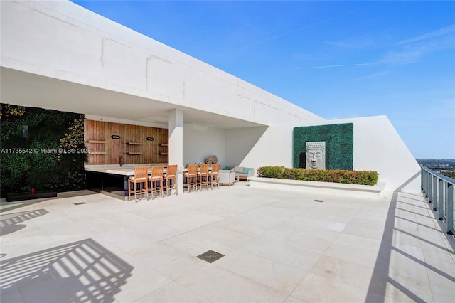 view of patio / terrace featuring an outdoor bar