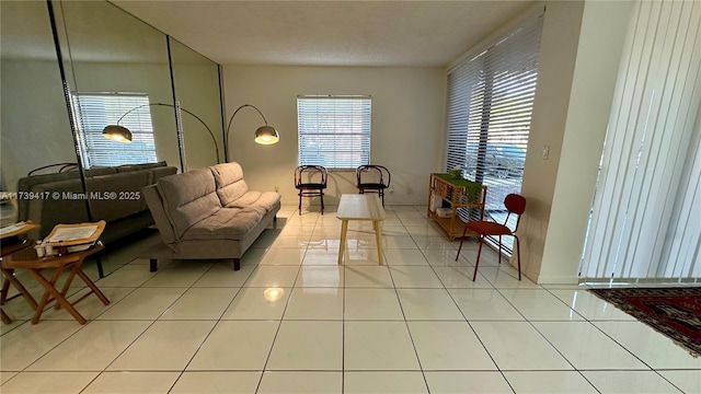 living area featuring light tile patterned flooring