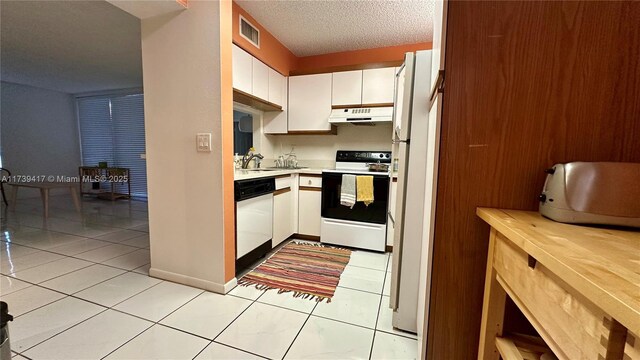 bathroom with vanity, toilet, and a shower with door