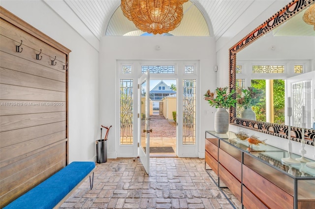 doorway featuring lofted ceiling