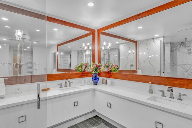 bathroom with vanity, ceiling fan, and a shower