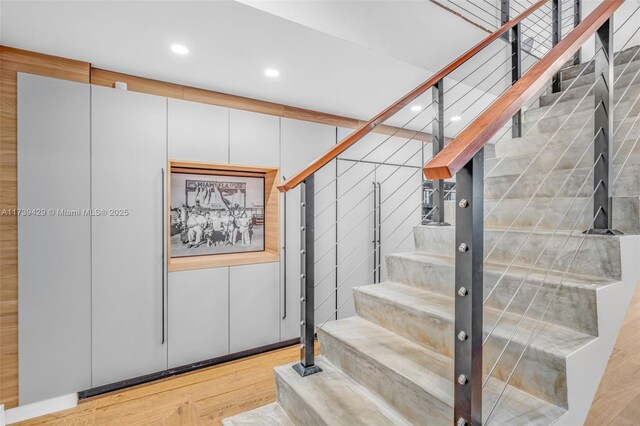 staircase featuring hardwood / wood-style floors