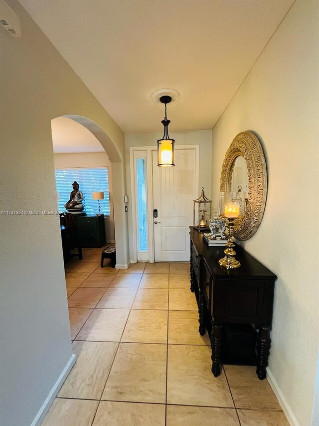 foyer with light tile patterned floors