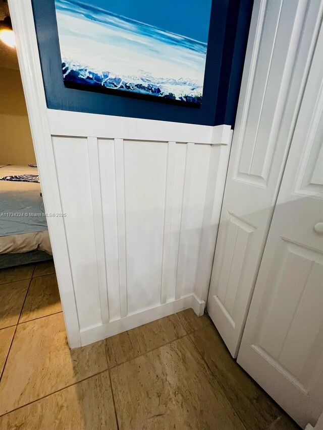 bathroom with tile patterned flooring and toilet