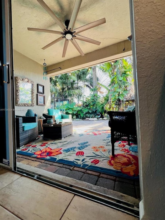 view of patio / terrace with ceiling fan and an outdoor hangout area