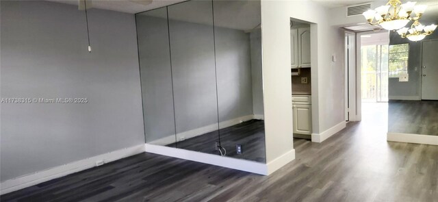 empty room featuring dark hardwood / wood-style flooring