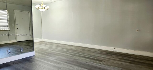 unfurnished bedroom with hardwood / wood-style flooring and a closet