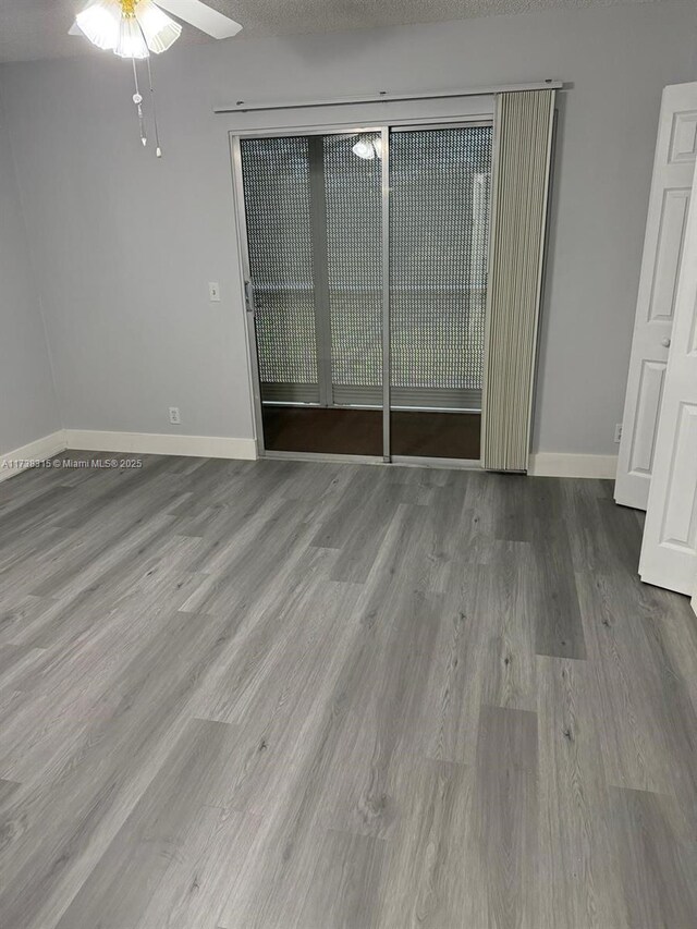 bathroom with walk in shower, vanity, and toilet