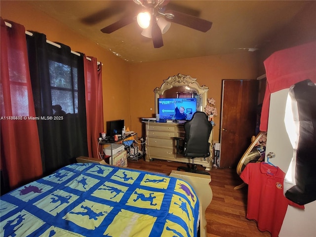 bedroom with hardwood / wood-style flooring and ceiling fan