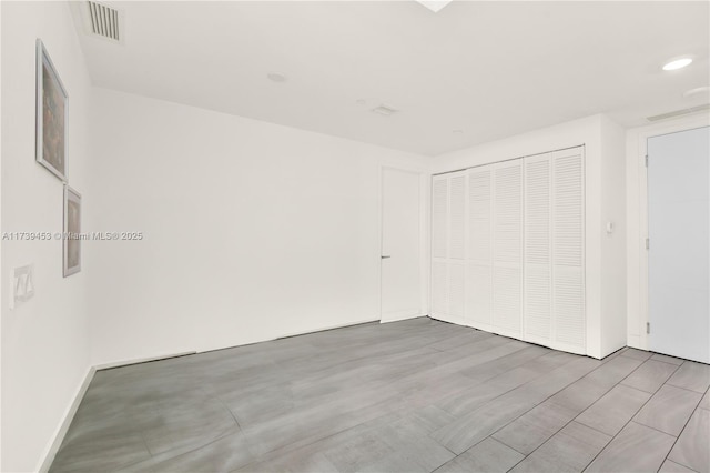 unfurnished room with light hardwood / wood-style flooring