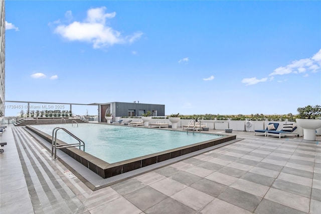 view of pool featuring a patio area