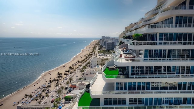 drone / aerial view with a view of the beach and a water view