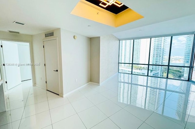 unfurnished room featuring light tile patterned floors