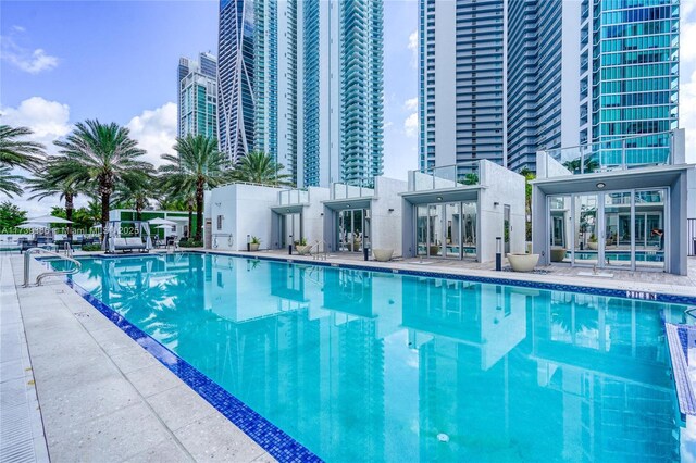 view of swimming pool with a patio area