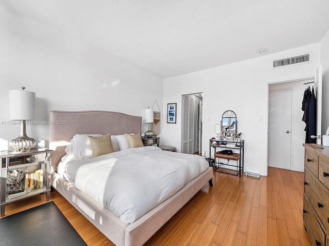 bedroom with wood-type flooring