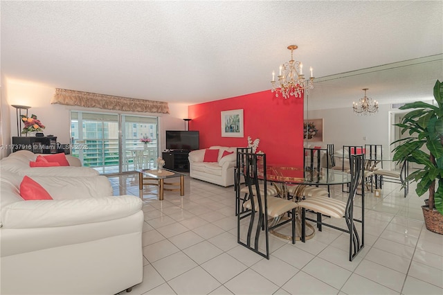 dining space with light tile patterned floors, a textured ceiling, and a notable chandelier