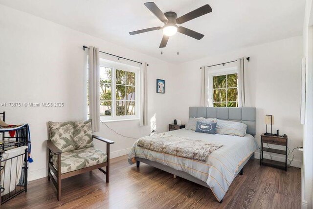 bedroom featuring dark wood-type flooring and ceiling fan