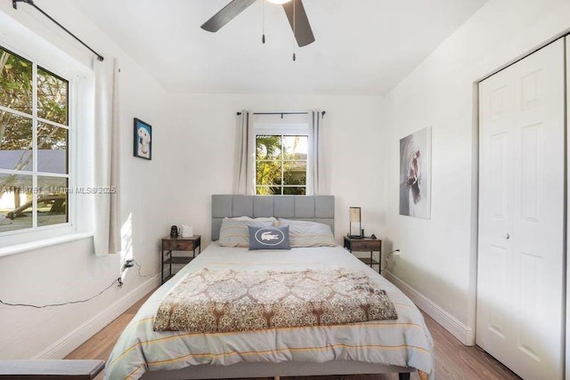 bedroom with ceiling fan and light hardwood / wood-style flooring