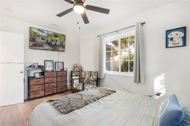 bedroom featuring light hardwood / wood-style flooring and ceiling fan