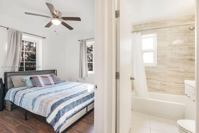 bedroom with tile patterned floors and ceiling fan