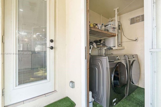 washroom featuring washer and dryer