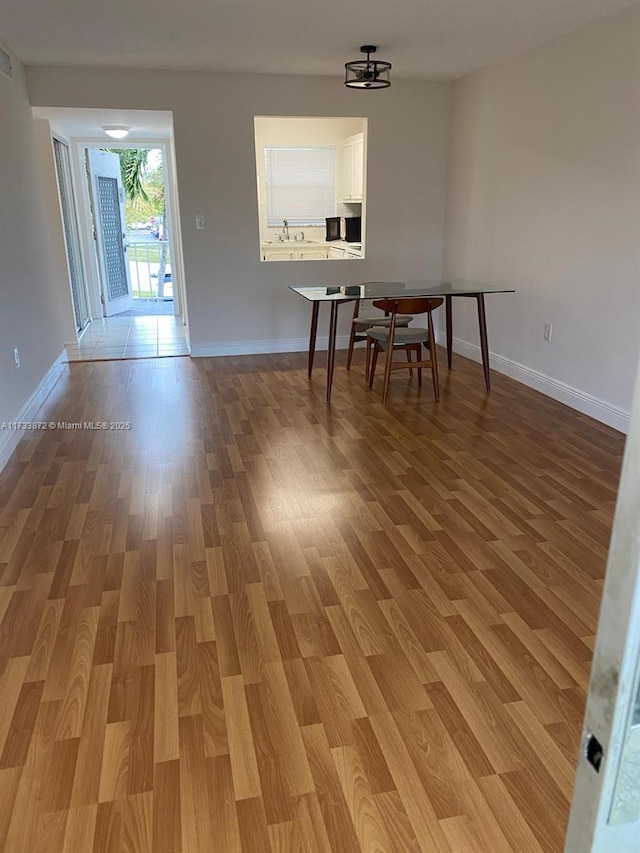 dining room with hardwood / wood-style flooring