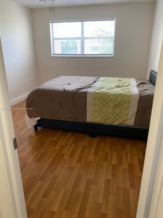 bedroom featuring hardwood / wood-style flooring