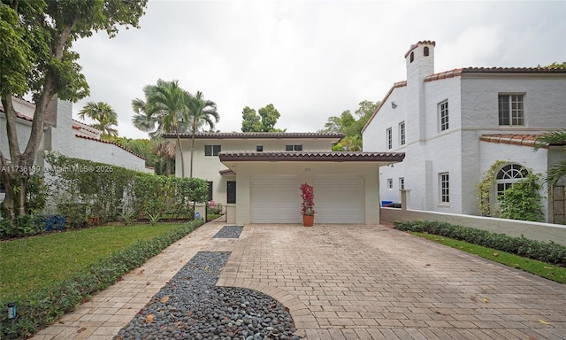 mediterranean / spanish-style home featuring a garage