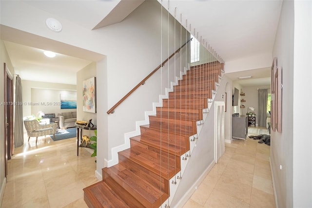 stairway featuring tile patterned floors