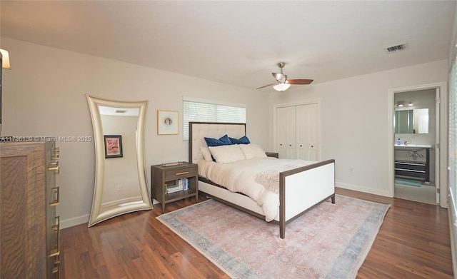 bedroom featuring dark wood-type flooring, a closet, and ceiling fan