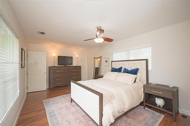 bedroom featuring dark hardwood / wood-style floors and ceiling fan