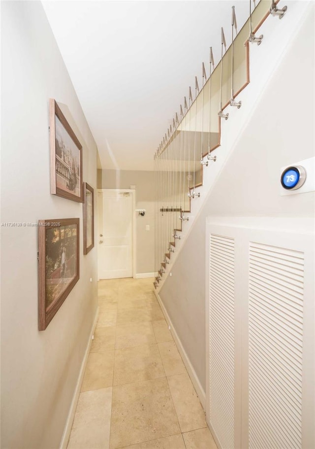 corridor featuring light tile patterned floors