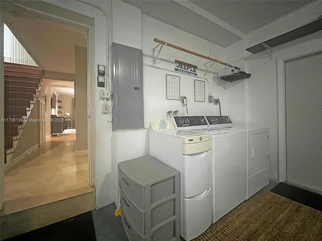 washroom with electric panel and washer and dryer