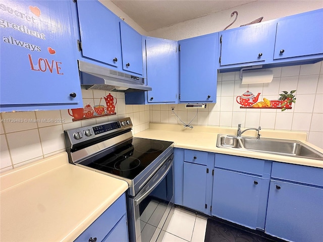 kitchen featuring blue cabinets, sink, stainless steel range with electric cooktop, light tile patterned floors, and backsplash