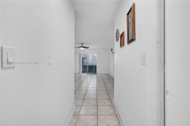 hall with light tile patterned flooring