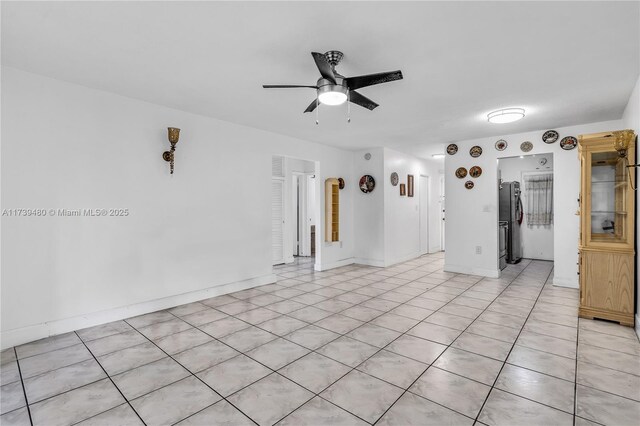 unfurnished living room featuring ceiling fan