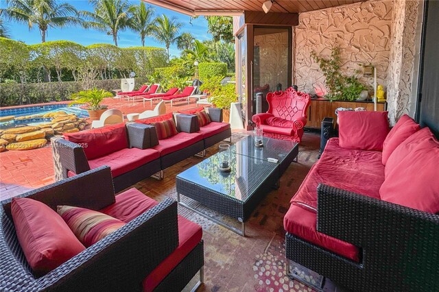 view of patio / terrace featuring an outdoor living space and a swimming pool