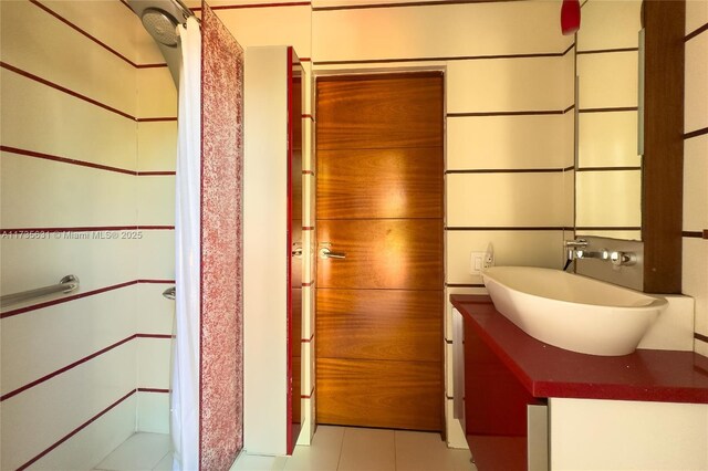 bathroom featuring tile patterned flooring and vanity