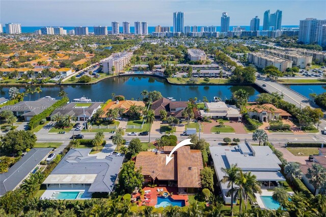 birds eye view of property with a water view