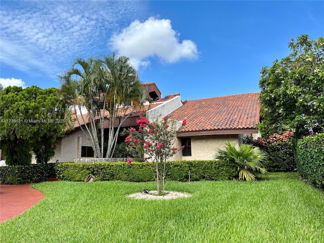 exterior space featuring a front lawn