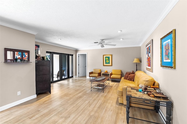 living room with french doors, ornamental molding, light hardwood / wood-style floors, and a textured ceiling