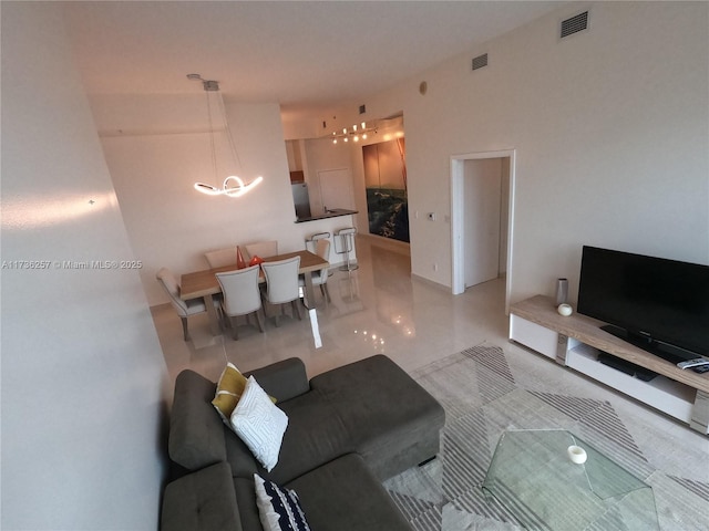 living room featuring an inviting chandelier